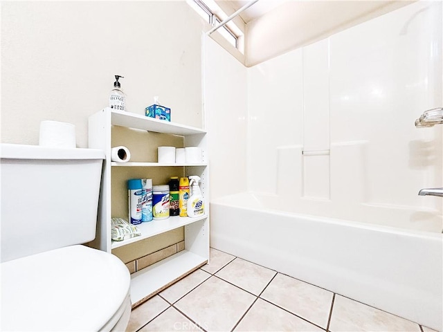 bathroom with tile patterned floors, toilet, and bathtub / shower combination