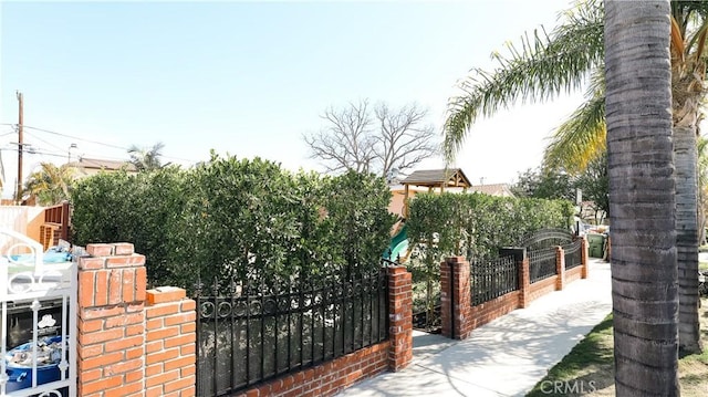 view of gate with fence