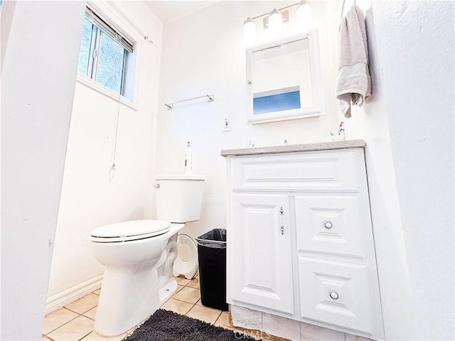 bathroom featuring tile patterned floors, toilet, and vanity