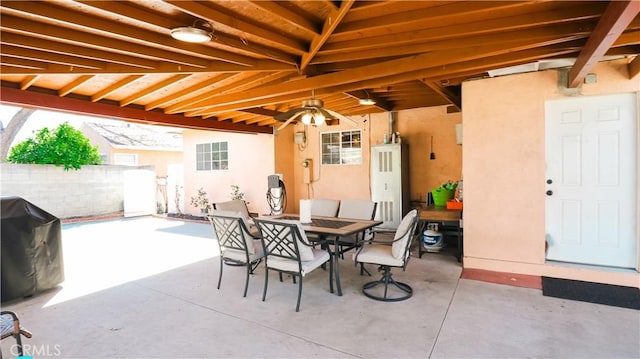 view of patio / terrace featuring outdoor dining area, a grill, and fence