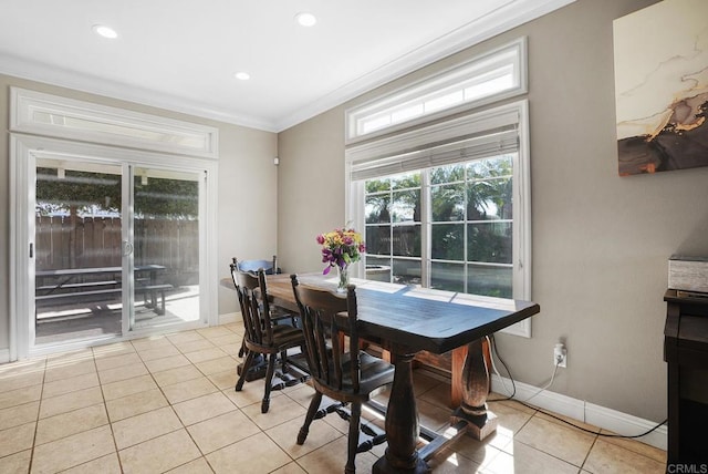 dining space featuring recessed lighting, baseboards, light tile patterned flooring, and crown molding