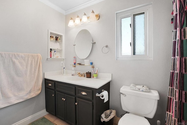 bathroom with tile patterned flooring, vanity, crown molding, and toilet