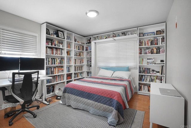 bedroom featuring wood finished floors