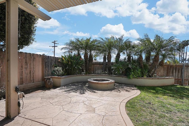 view of patio with a fenced backyard and an outdoor fire pit