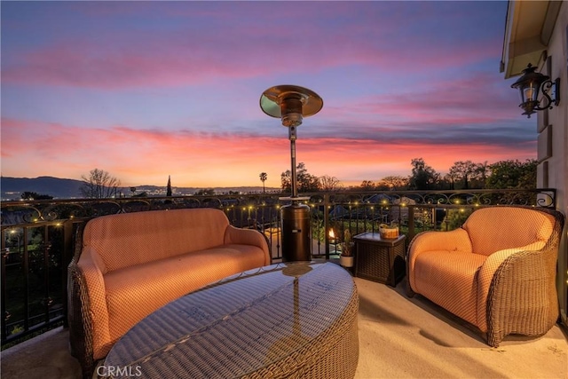 view of patio with an outdoor living space and a balcony