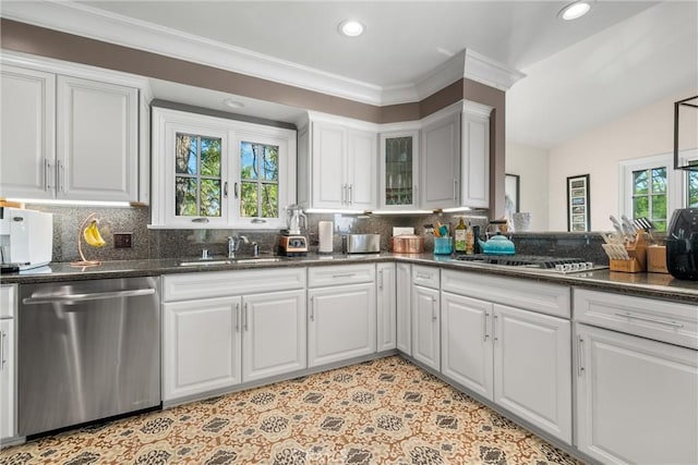 kitchen featuring white cabinetry, tasteful backsplash, appliances with stainless steel finishes, and a sink