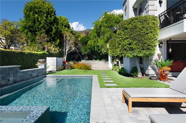 view of pool featuring a fenced in pool and a patio area