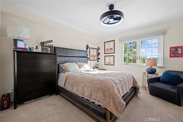 carpeted bedroom with baseboards and crown molding