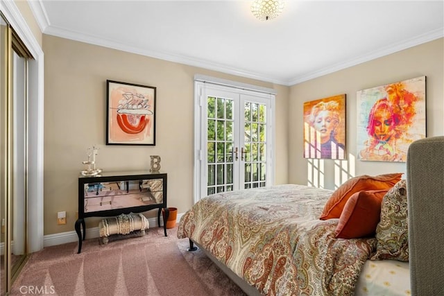 carpeted bedroom with access to exterior, baseboards, ornamental molding, french doors, and a closet