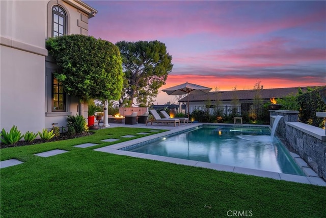 view of pool featuring a fenced in pool, a lawn, a patio area, and fence