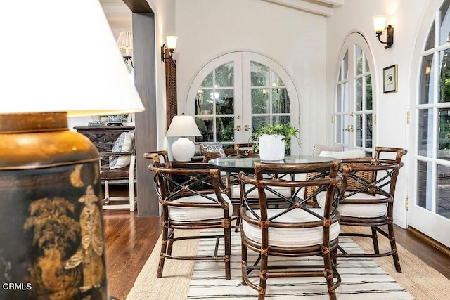 dining room featuring french doors and wood finished floors