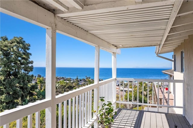 balcony featuring a water view