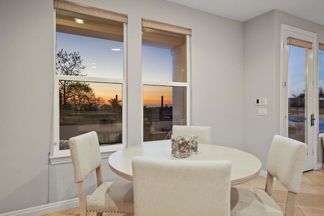 dining area featuring baseboards