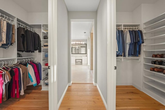 walk in closet featuring hardwood / wood-style floors