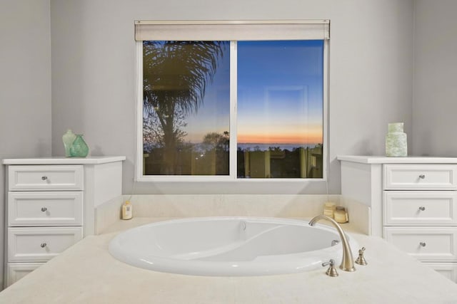 bathroom with a garden tub