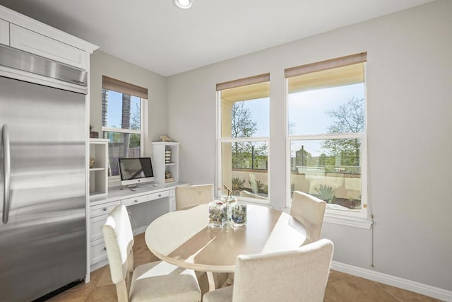 dining room featuring light tile patterned floors, recessed lighting, and baseboards