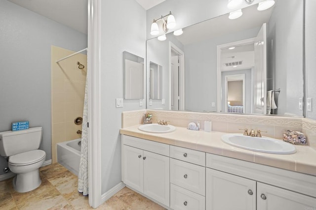 full bath with double vanity, toilet, visible vents, and a sink