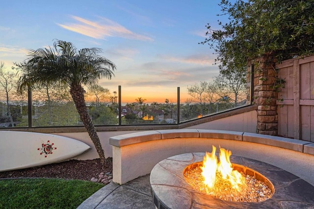 patio terrace at dusk with an outdoor fire pit