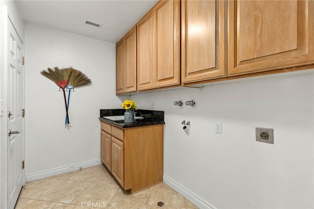 laundry room featuring visible vents, cabinet space, hookup for an electric dryer, and baseboards