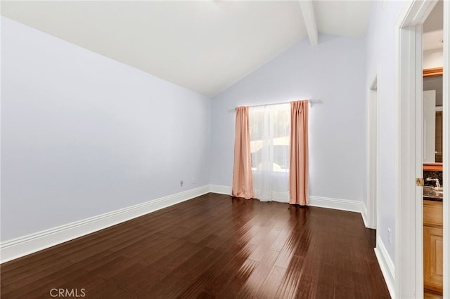 empty room with lofted ceiling with beams, baseboards, and dark wood-style flooring