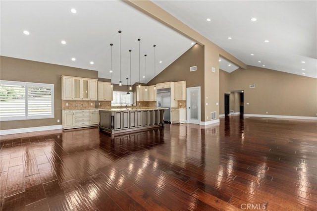 living area featuring baseboards, visible vents, dark wood-style flooring, and high vaulted ceiling