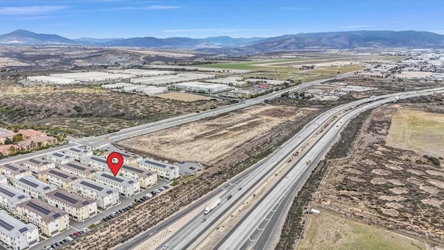 birds eye view of property with a mountain view