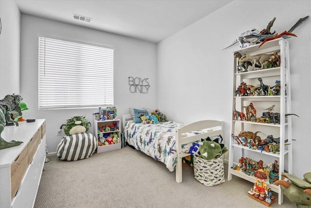 bedroom with visible vents and carpet floors