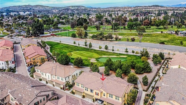 bird's eye view featuring golf course view, a residential view, and a mountain view