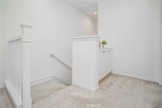 stairway with carpet flooring, recessed lighting, and baseboards