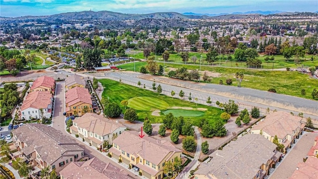 birds eye view of property featuring golf course view, a residential view, and a mountain view