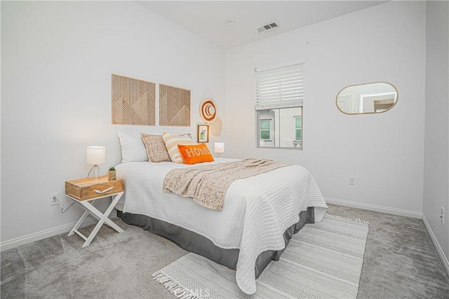 carpeted bedroom with baseboards and visible vents