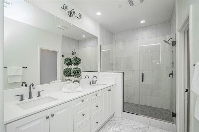 full bath featuring a sink, visible vents, and a shower stall