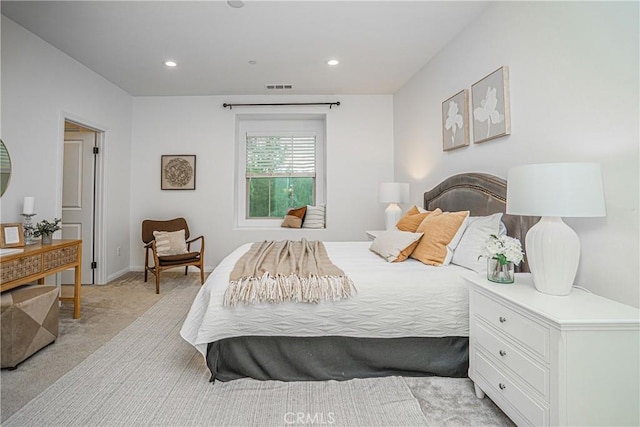 bedroom with recessed lighting, visible vents, and light colored carpet