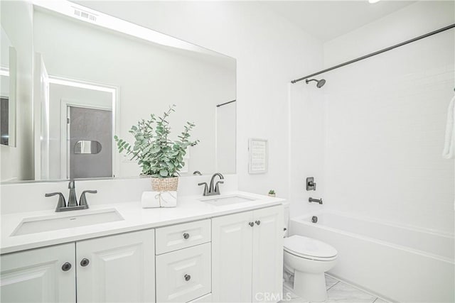 full bath featuring a sink, shower / bathtub combination, toilet, and double vanity