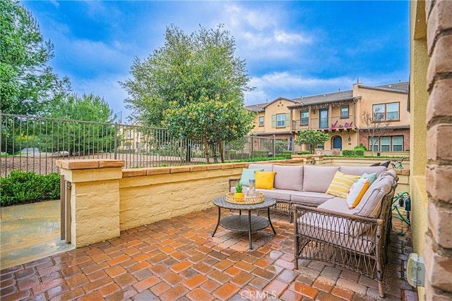 view of patio / terrace with an outdoor living space and fence