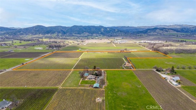 aerial view featuring a rural view and a mountain view