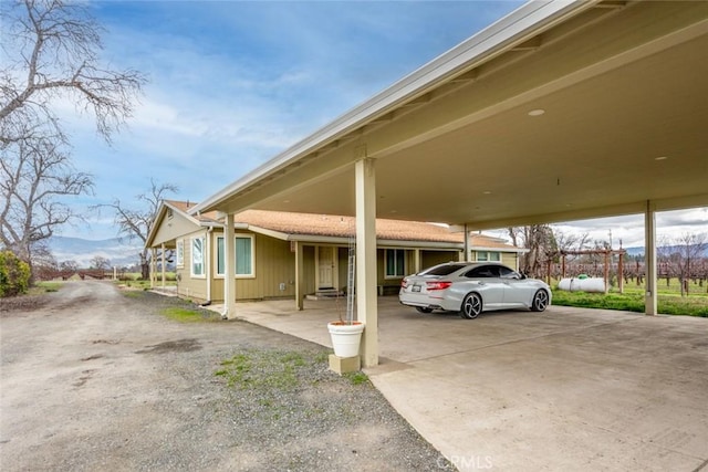 view of parking featuring a carport and driveway