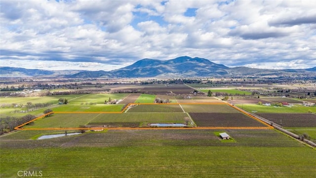 birds eye view of property featuring a mountain view and a rural view