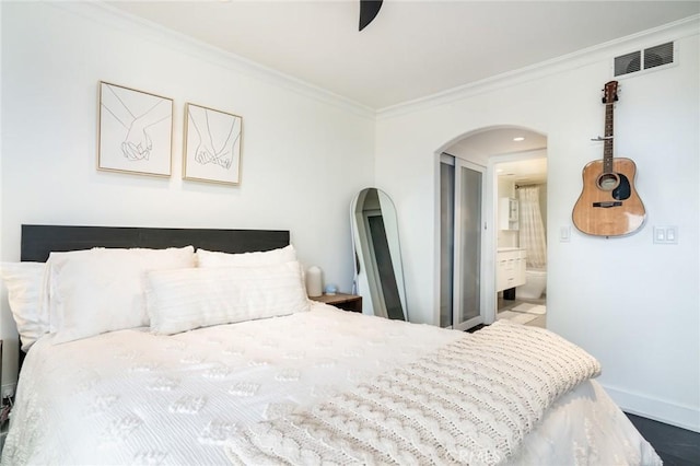 1222 Las Arenas Way Unit 23, Costa Mesa, CA 92627 - bedroom featuring arched walkways, visible vents, baseboards, and ornamental molding