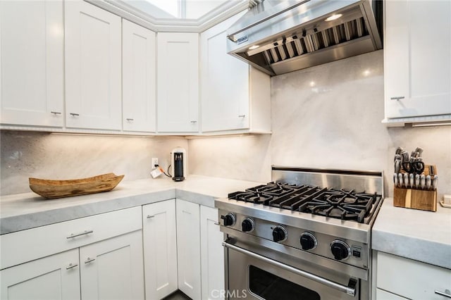 1222 Las Arenas Way Unit 23, Costa Mesa, CA 92627 - kitchen featuring high end stove, white cabinetry, decorative backsplash, light countertops, and premium range hood