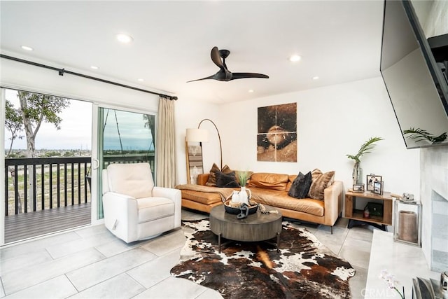 1222 Las Arenas Way Unit 23, Costa Mesa, CA 92627 - living room with tile patterned flooring, a premium fireplace, a ceiling fan, and recessed lighting