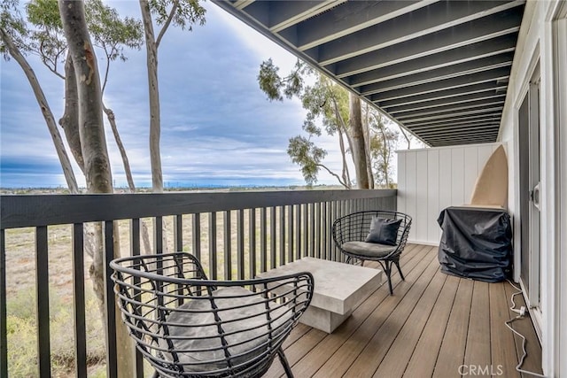 wooden deck featuring area for grilling