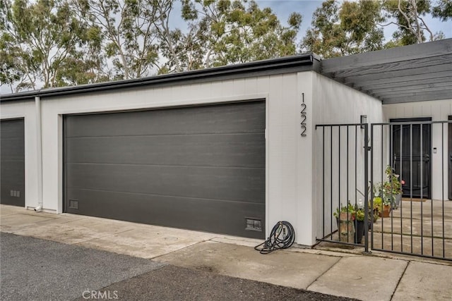 1222 Las Arenas Way Unit 23, Costa Mesa, CA 92627 - garage with a gate