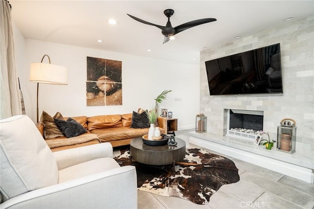 1222 Las Arenas Way Unit 23, Costa Mesa, CA 92627 - living room featuring a fireplace, a ceiling fan, tile patterned flooring, and recessed lighting