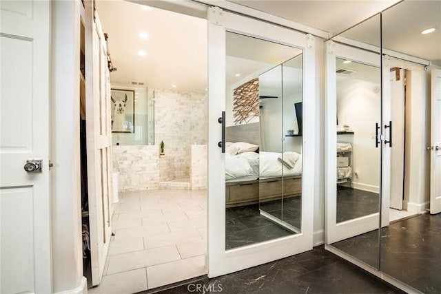 bathroom with recessed lighting, visible vents, and ensuite bath