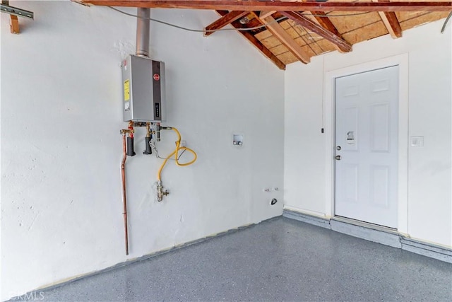 garage featuring tankless water heater