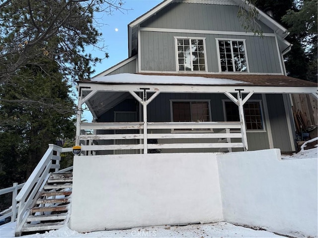 view of front of home featuring stairway