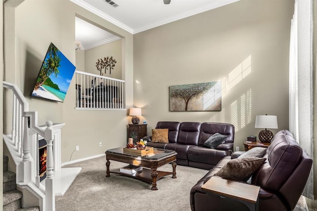 living room featuring visible vents, baseboards, stairway, ornamental molding, and carpet flooring