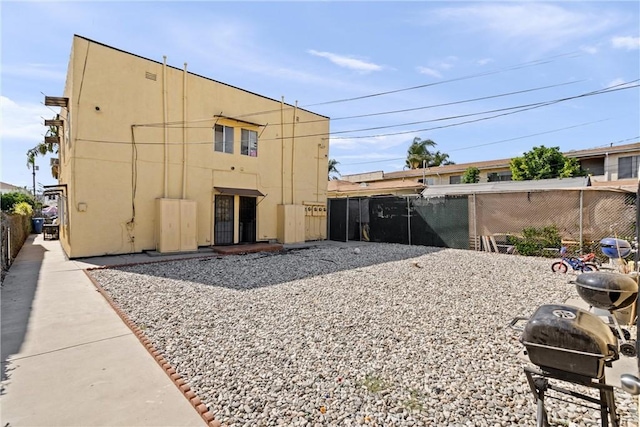 view of outdoor structure with fence