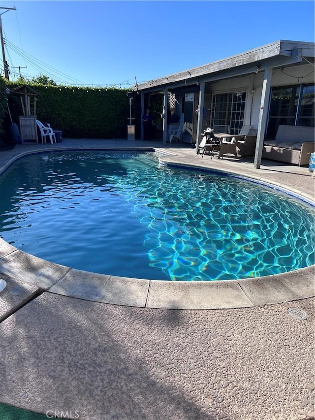 view of pool featuring a patio and a fenced in pool